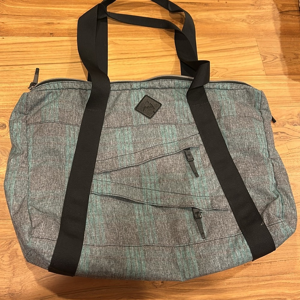 Burton shoulder bag, multiple inner and outer zippers